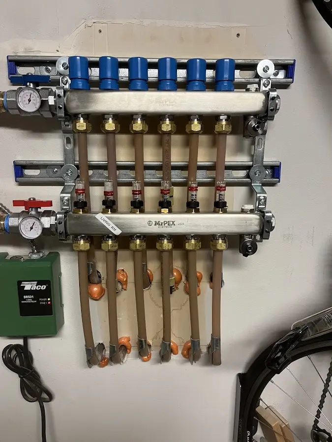 Plumber performing Water Heater Repair at a residential property in Milford